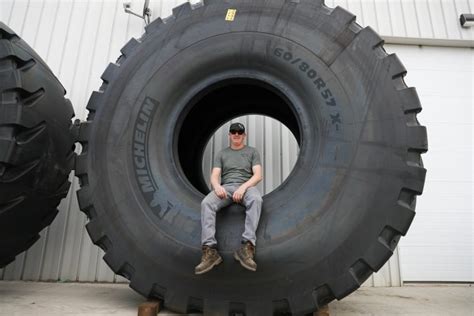 The Bridgestone 59/80R63 V-Steel E-Lug S tire which the Titan exceeds stands 4. . Huge tirs